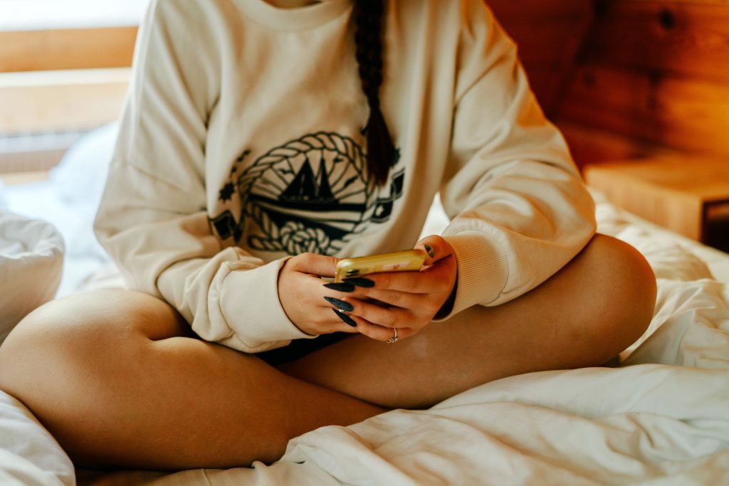 Portrait of a person with mobile phone in hand